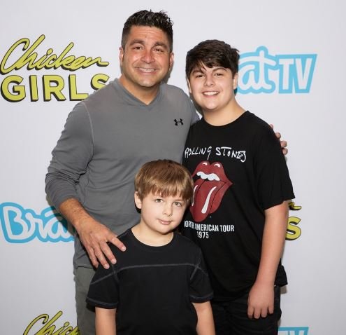 Enzo Lopez with his sibling and father